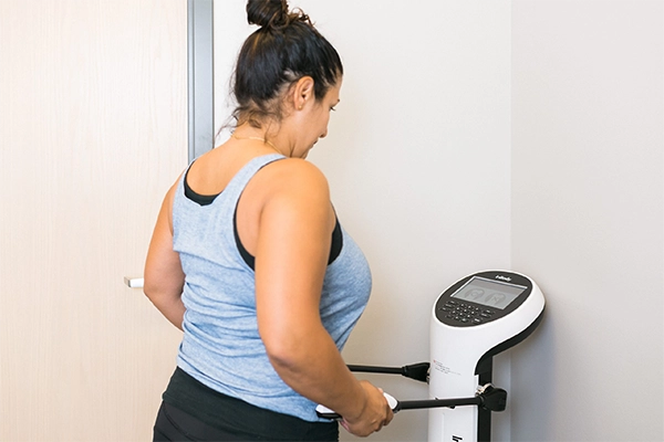 Weight Loss Kenosha WI Woman On Machine